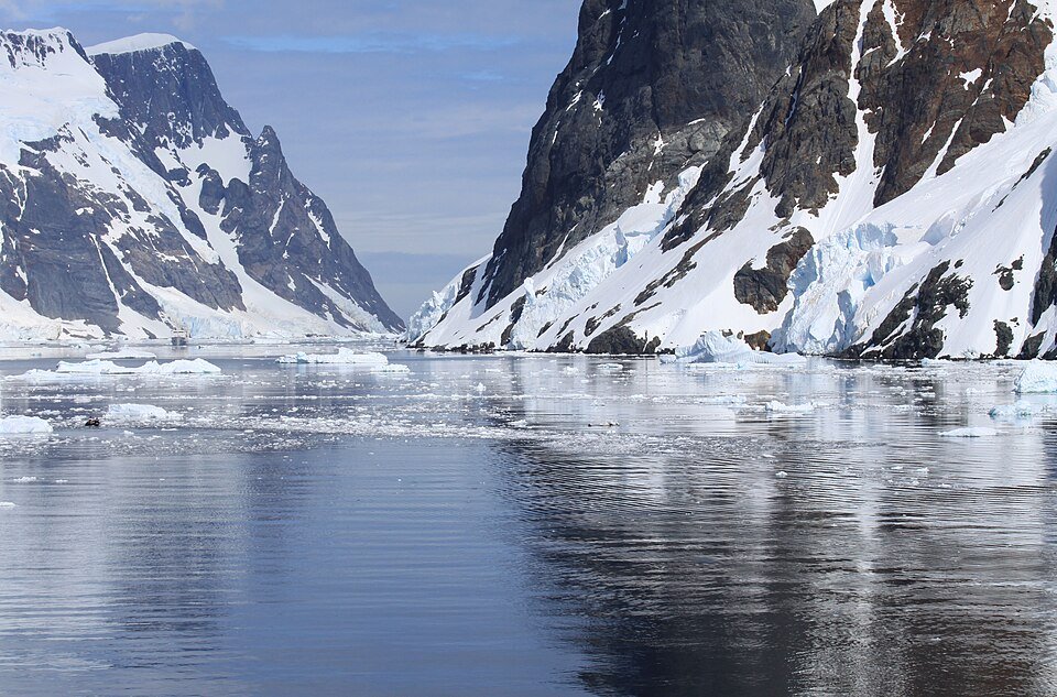 Mountain reflections in the Lemaire Channel beside the Antarctic Peninsula