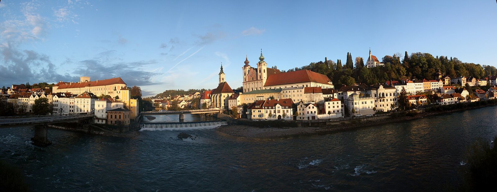 Steyr riverside panorama with historic buildings and church towers