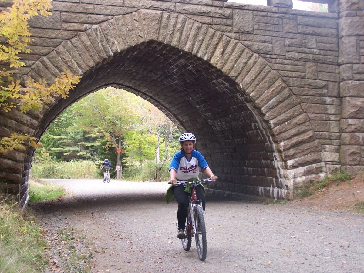 A bike rider travels one of Acadia National Park's famed carriage roads.