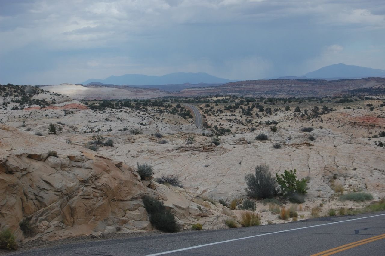 A serene landscape of sandstone stretches as far as the eye can see in the area near the Escalante River and Escalante Canyons of Utah.