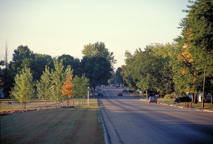 The early morning sun casts a shadow across the Minnesota River Valley Scenic Byway south of Belle Plaine in the fall.