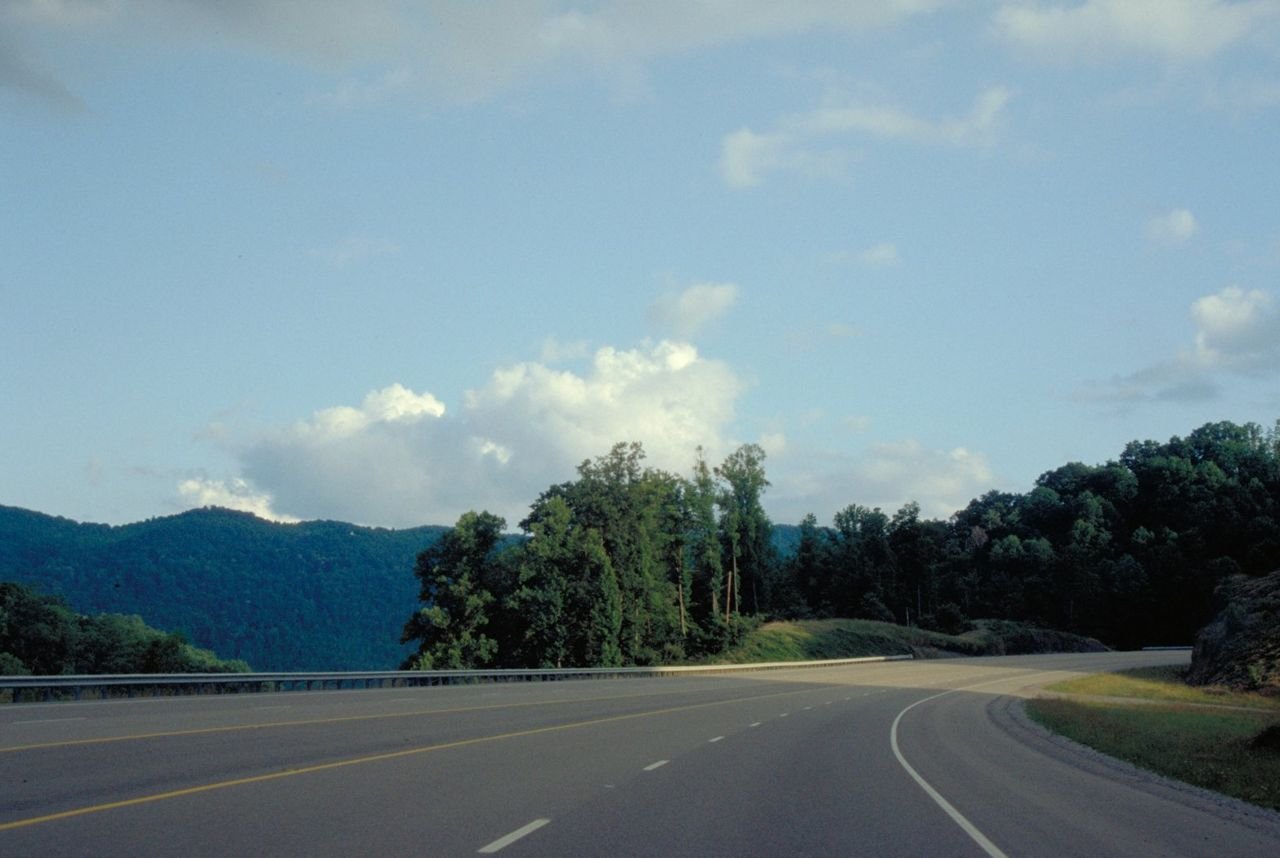 Mountain shadows fall across Highway 23.