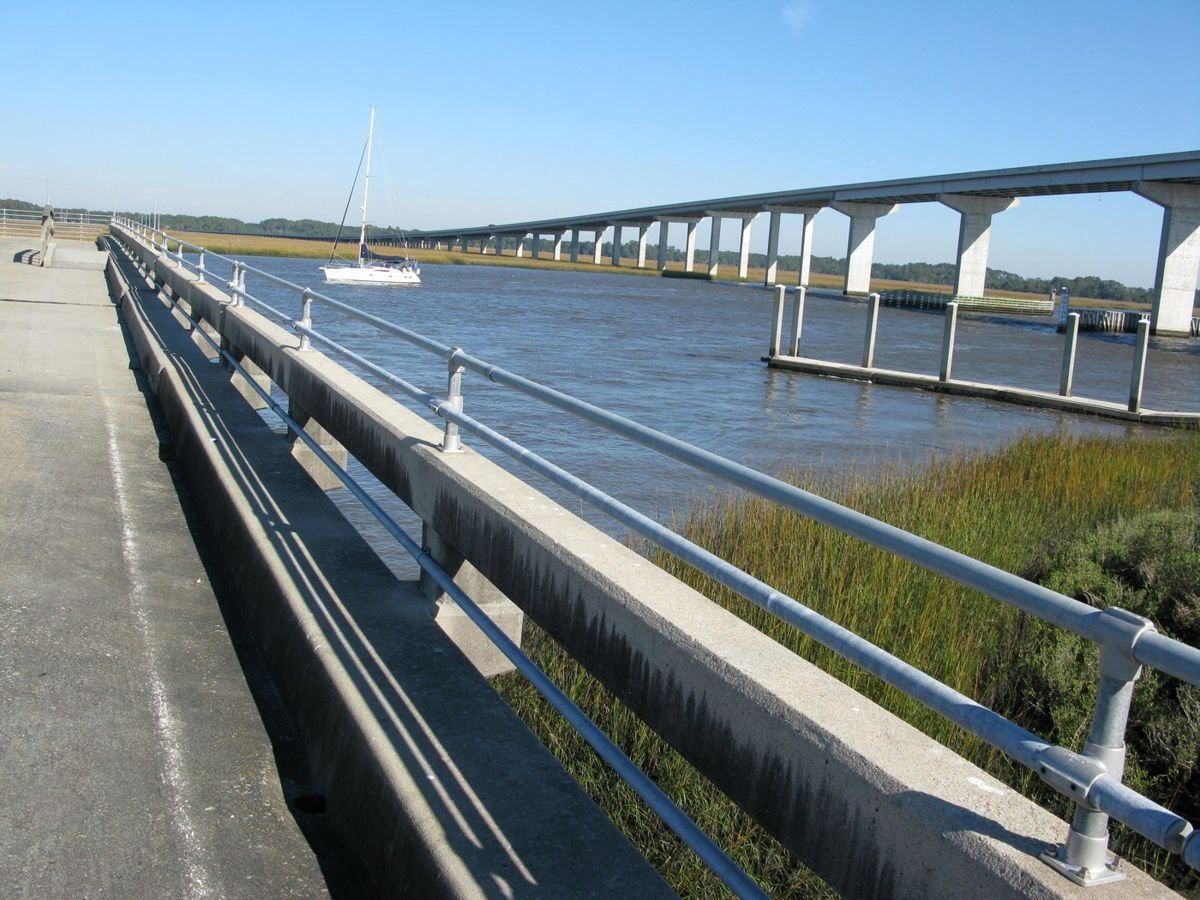The bridge at Dawhoo Landing crawls across the crystal water and fresh green grass. Below the bridge, a public boat landing allows access to the water as well as closeup views of pelicans and boats. The traveler can also go crabbing, fishing or have a picnic.