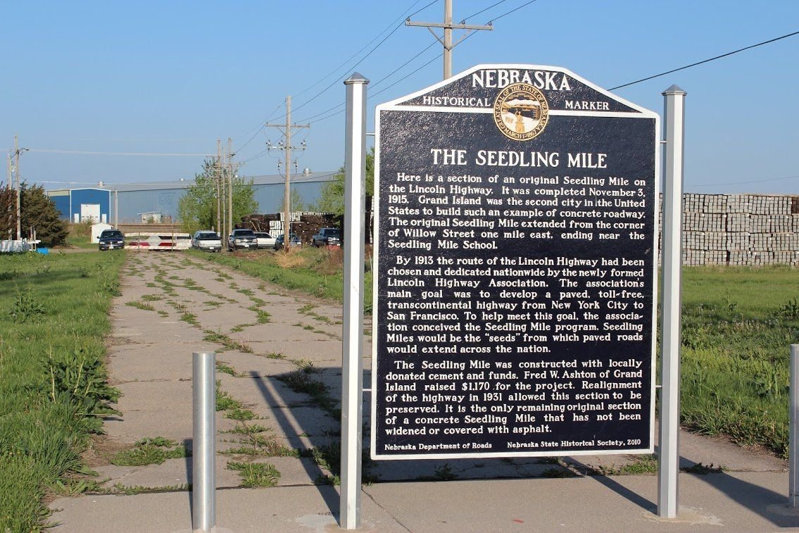 The only remaining original intact section of a Lincoln Highway Seedling Mile is located at Grand Island Nebraska and is commemorated with a historical marker placed by History Nebraska.